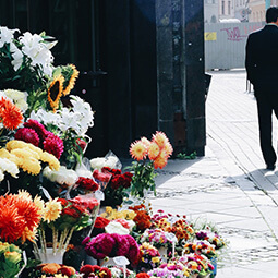 town flowers stand morning streets empty man walking suit travel real social UGC photography