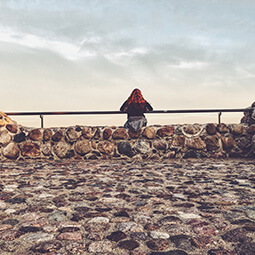 girl looking sea sky clouds rock stones solitude travel real social UGC photography